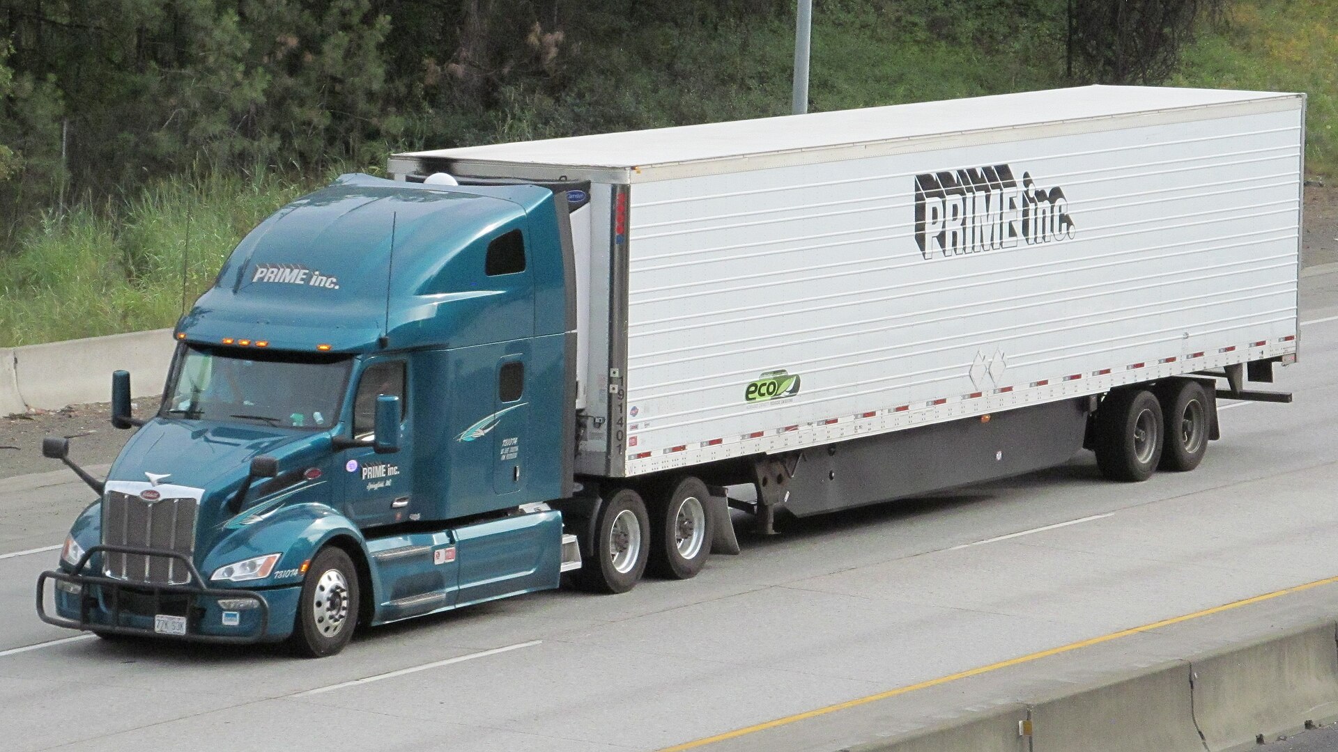 A refrigerated Peterbilt semi-trailer truck running Interstate 90 near Spokane, Washington